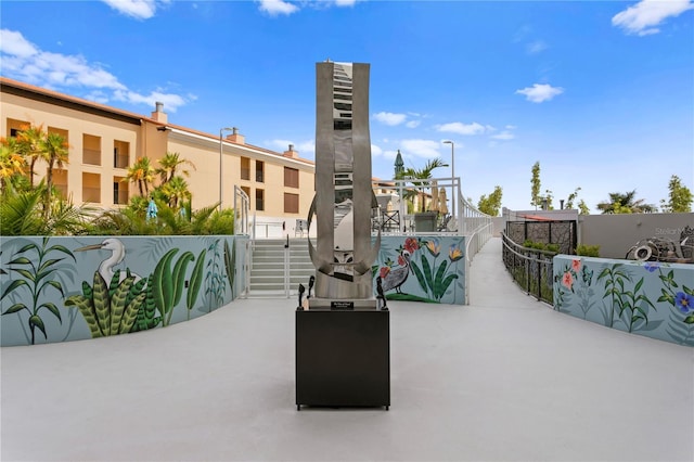 199 Dali Blvd Unit 2, Saint Petersburg, FL 33701 - view of home's community with fence, a patio area, and stairs