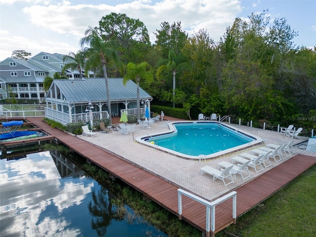 2533 Dolly Bay Dr Unit 203, Palm Harbor, FL 34684 - community pool with fence and a patio area