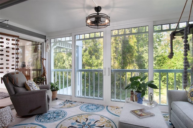 2533 Dolly Bay Dr Unit 203, Palm Harbor, FL 34684 - sunroom with healthy amount of natural light and a chandelier