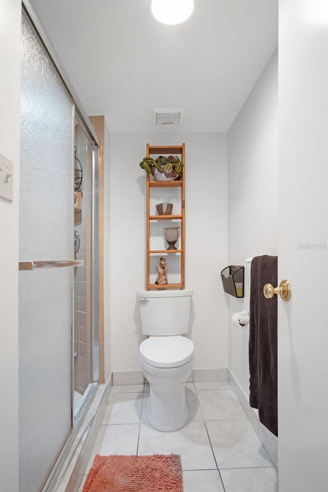 2533 Dolly Bay Dr Unit 203, Palm Harbor, FL 34684 - bathroom with a stall shower, toilet, baseboards, and tile patterned floors