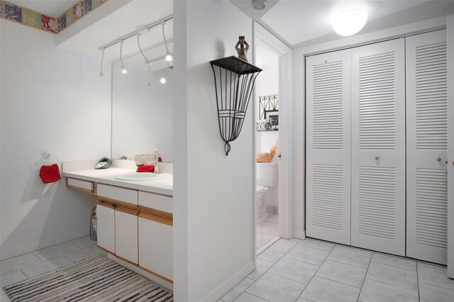 2533 Dolly Bay Dr Unit 203, Palm Harbor, FL 34684 - bathroom with a closet, toilet, vanity, tile patterned floors, and baseboards
