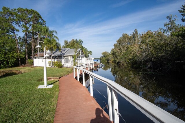 2533 Dolly Bay Dr Unit 203, Palm Harbor, FL 34684 - dock area featuring a water view and a yard