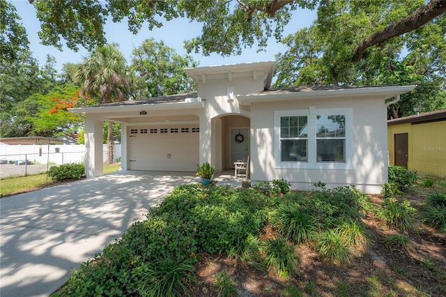 3906 N Lynn Ave, Tampa, FL 33603 - view of front of property with an attached garage, concrete driveway, and stucco siding