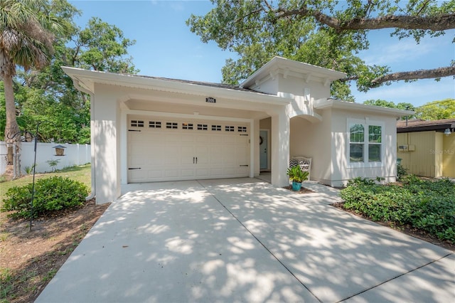 3906 N Lynn Ave, Tampa, FL 33603 - view of front of property with concrete driveway, a garage, and stucco siding