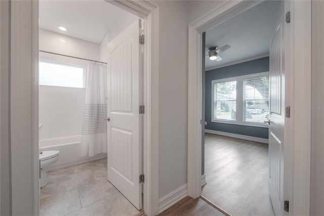 3906 N Lynn Ave, Tampa, FL 33603 - full bathroom featuring toilet, shower / bath combo with shower curtain, baseboards, a ceiling fan, and crown molding