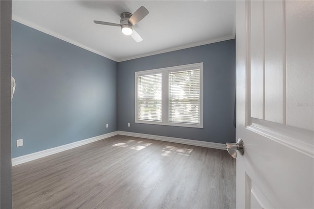 3906 N Lynn Ave, Tampa, FL 33603 - spare room featuring wood finished floors, baseboards, ceiling fan, and ornamental molding