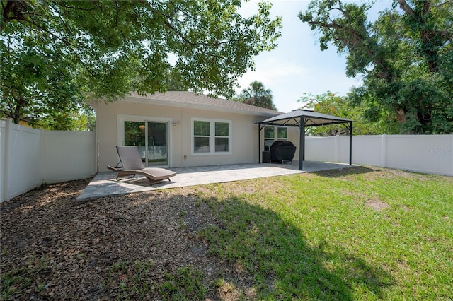 3906 N Lynn Ave, Tampa, FL 33603 - back of property with a gazebo, a patio, and stucco siding