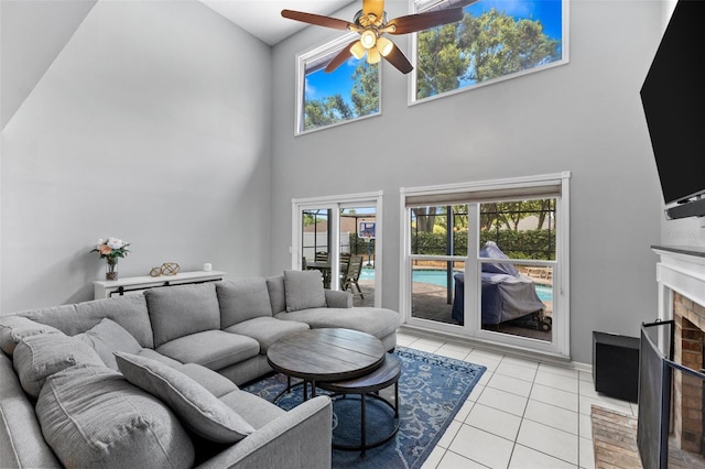 5032 Cypress Trace Dr, Tampa, FL 33624 - living area with a high ceiling, light tile patterned floors, a ceiling fan, and a fireplace