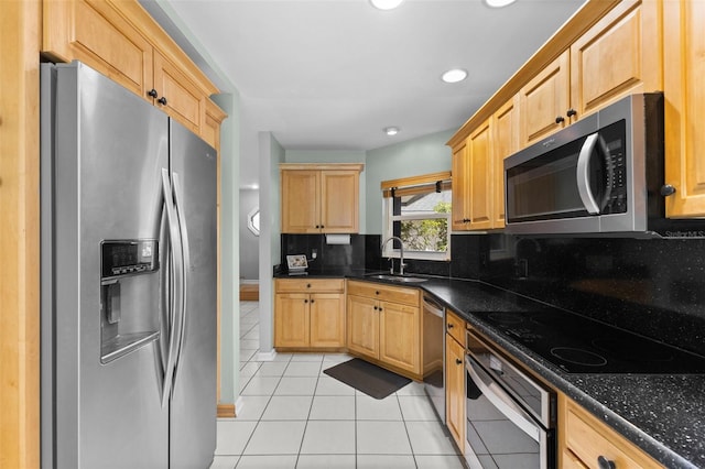 5032 Cypress Trace Dr, Tampa, FL 33624 - kitchen featuring stainless steel appliances, a sink, light tile patterned floors, light brown cabinets, and tasteful backsplash