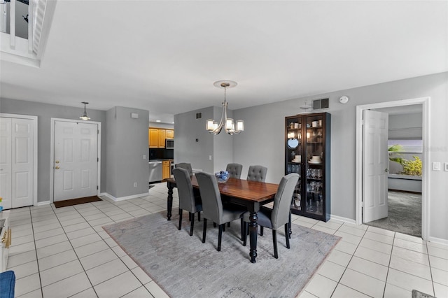 5032 Cypress Trace Dr, Tampa, FL 33624 - dining space featuring light tile patterned floors, baseboards, and a chandelier