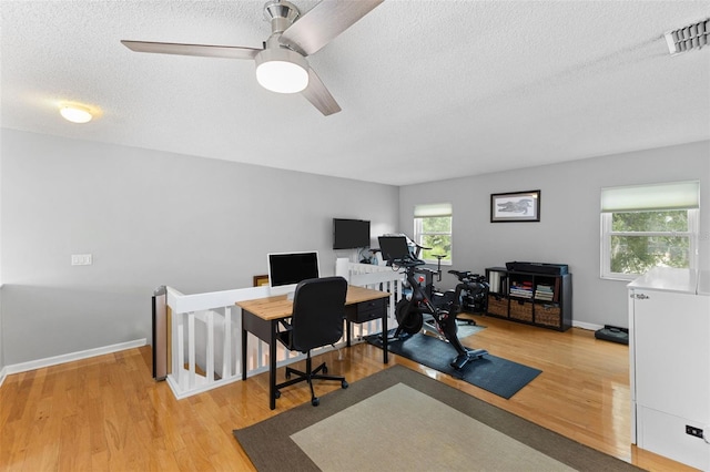 5032 Cypress Trace Dr, Tampa, FL 33624 - office space featuring a textured ceiling, wood finished floors, a ceiling fan, and baseboards