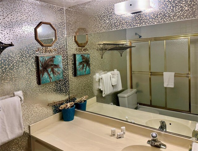 16330 Gulf Blvd Unit 201, Redington Beach, FL 33708 - full bath featuring an enclosed shower, toilet, and vanity