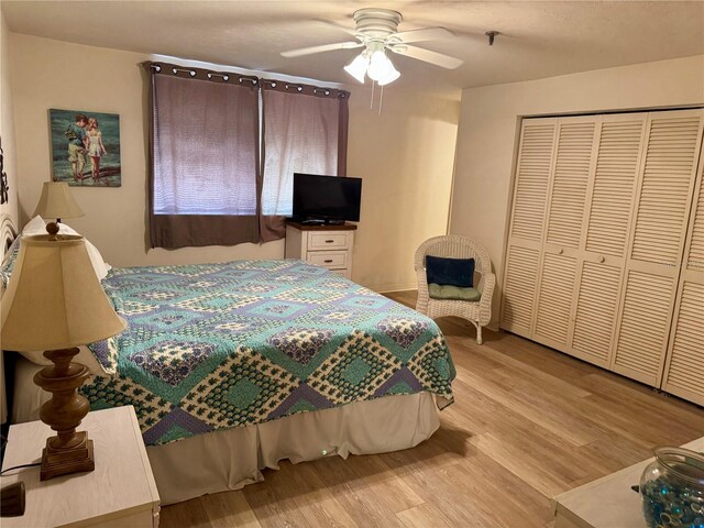 16330 Gulf Blvd Unit 201, Redington Beach, FL 33708 - bedroom with wood finished floors, a ceiling fan, and a closet