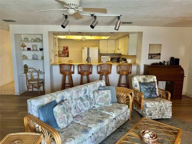 16330 Gulf Blvd Unit 201, Redington Beach, FL 33708 - living area with a ceiling fan, wood finished floors, built in features, and a textured ceiling
