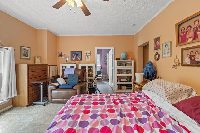 tiled bedroom featuring a textured ceiling, ornamental molding, and a ceiling fan