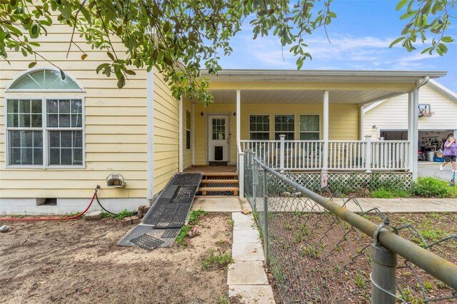 view of front of house with a porch and crawl space