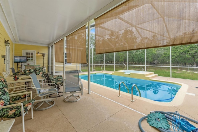swimming pool with a patio, fence, and a lanai