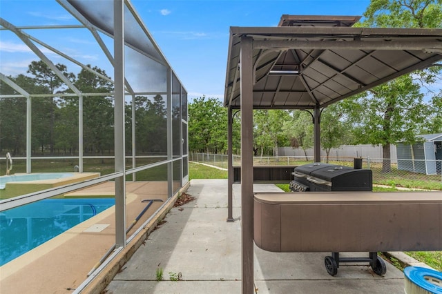 view of patio featuring fence and a lanai