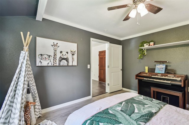905 8th Ave SW, Largo, FL 33770 - bedroom with wood finished floors, ornamental molding, ceiling fan, beam ceiling, and a textured wall