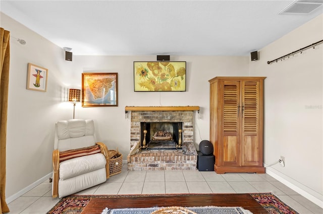 8083 Bayhaven Dr, Seminole, FL 33776 - living area with tile patterned floors, a fireplace, and baseboards
