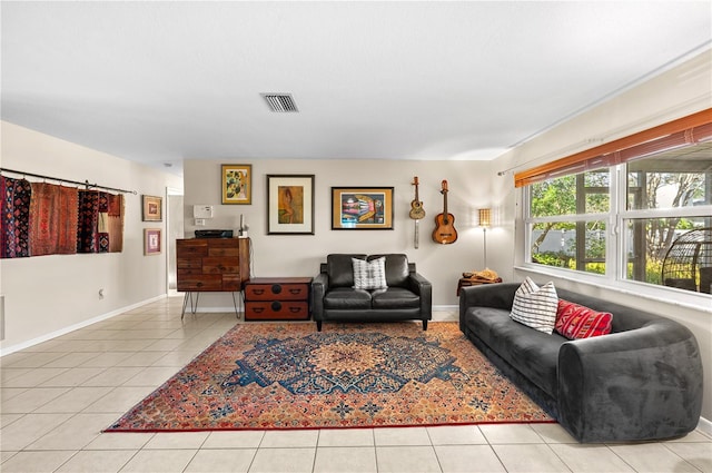 8083 Bayhaven Dr, Seminole, FL 33776 - living room featuring tile patterned flooring and baseboards