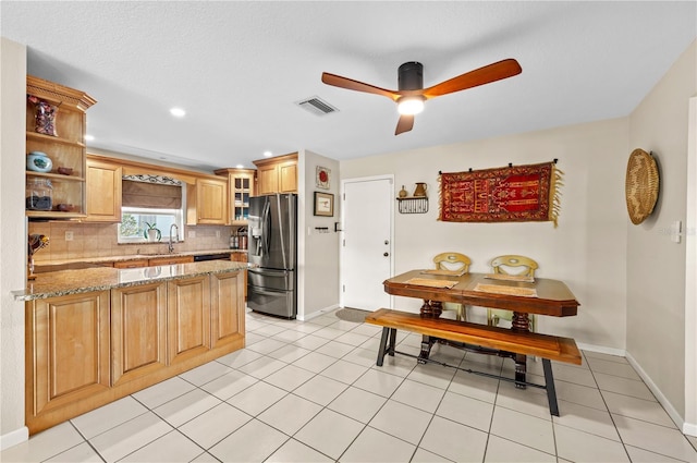 8083 Bayhaven Dr, Seminole, FL 33776 - kitchen featuring stainless steel refrigerator with ice dispenser, decorative backsplash, a ceiling fan, a peninsula, and open shelves