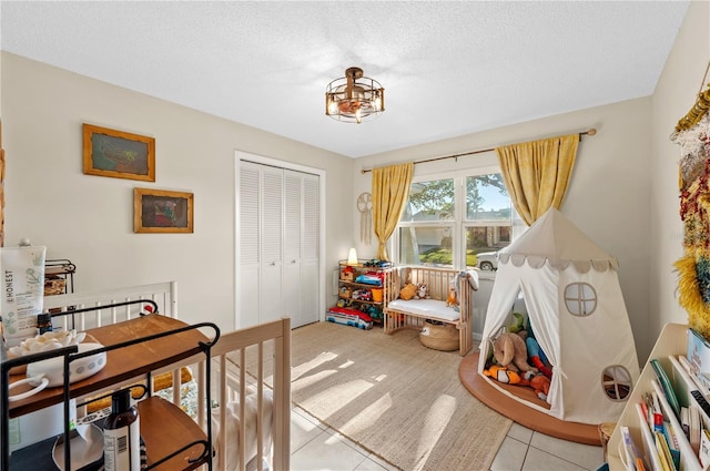 8083 Bayhaven Dr, Seminole, FL 33776 - playroom with tile patterned flooring and a textured ceiling