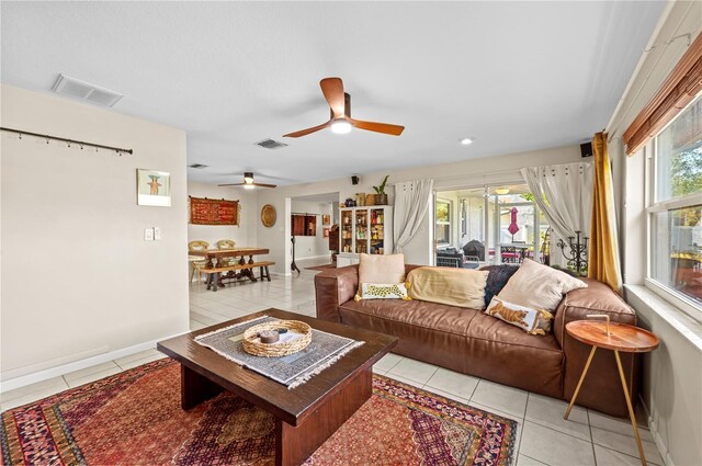 8083 Bayhaven Dr, Seminole, FL 33776 - living area with light tile patterned floors, a ceiling fan, baseboards, and recessed lighting