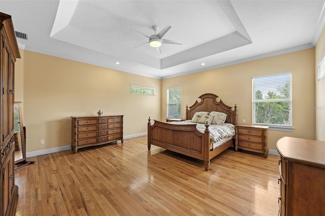 4515 W Leona St, Tampa, FL 33629 - bedroom featuring a tray ceiling, light wood-type flooring, ornamental molding, ceiling fan, and recessed lighting