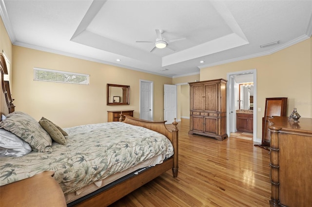 4515 W Leona St, Tampa, FL 33629 - bedroom featuring a tray ceiling, light wood-style floors, ornamental molding, recessed lighting, and ceiling fan