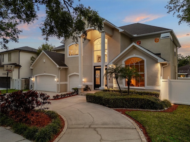 4515 W Leona St, Tampa, FL 33629 - mediterranean / spanish-style home featuring stucco siding, a garage, and driveway