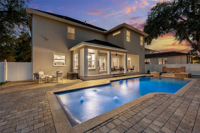 4515 W Leona St, Tampa, FL 33629 - rear view of house with a patio, stucco siding, a fenced backyard, a ceiling fan, and an outdoor living space