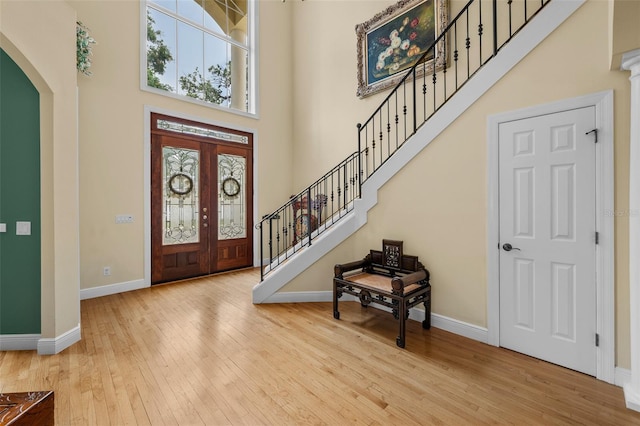 4515 W Leona St, Tampa, FL 33629 - foyer entrance featuring a high ceiling, healthy amount of natural light, arched walkways, and hardwood / wood-style floors
