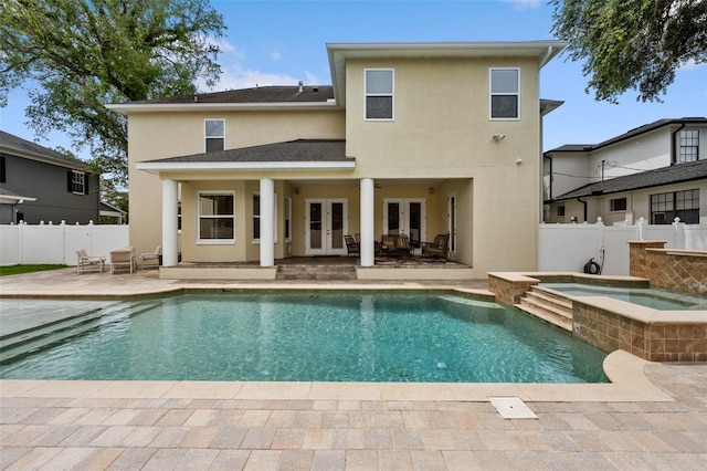 4515 W Leona St, Tampa, FL 33629 - rear view of house with french doors, stucco siding, a patio area, and a fenced backyard