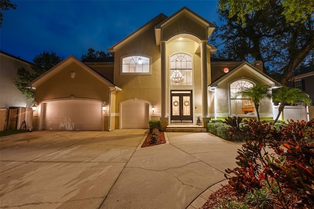 4515 W Leona St, Tampa, FL 33629 - view of front of home featuring stucco siding, french doors, concrete driveway, and an attached garage