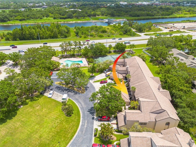 3044 Red Oak Ct Unit 204, Palm Harbor, FL 34684 - drone / aerial view of a nearby body of water, a tree filled landscape, and a pool