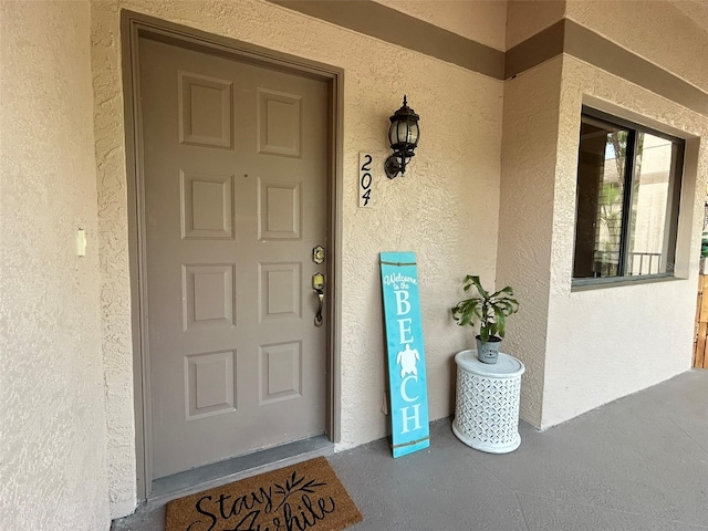 3044 Red Oak Ct Unit 204, Palm Harbor, FL 34684 - property entrance with stucco siding