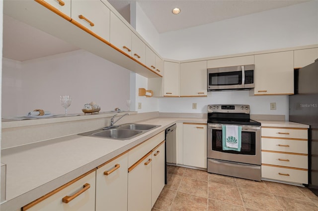 3044 Red Oak Ct Unit 204, Palm Harbor, FL 34684 - kitchen with black appliances, a sink, light countertops, and light stone finish floors