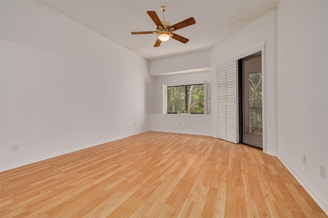 3044 Red Oak Ct Unit 204, Palm Harbor, FL 34684 - spare room featuring light wood-style flooring, ceiling fan, and baseboards