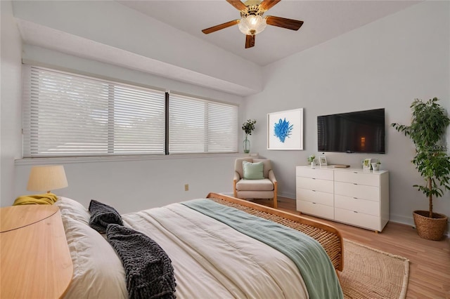 3044 Red Oak Ct Unit 204, Palm Harbor, FL 34684 - bedroom with light wood-style floors, baseboards, and a ceiling fan