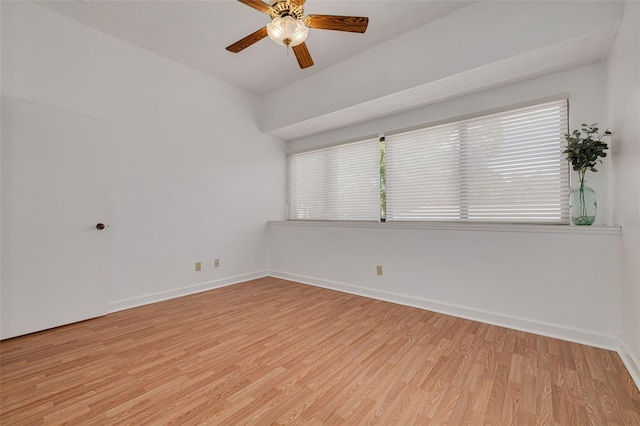 3044 Red Oak Ct Unit 204, Palm Harbor, FL 34684 - unfurnished room with light wood-style floors, a ceiling fan, and baseboards