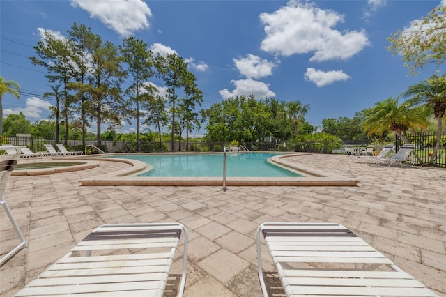 3044 Red Oak Ct Unit 204, Palm Harbor, FL 34684 - community pool with a patio and a hot tub