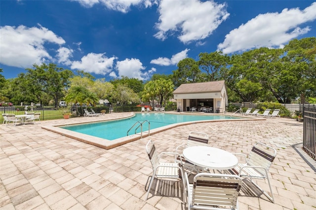 3044 Red Oak Ct Unit 204, Palm Harbor, FL 34684 - community pool with a patio and view of wooded area