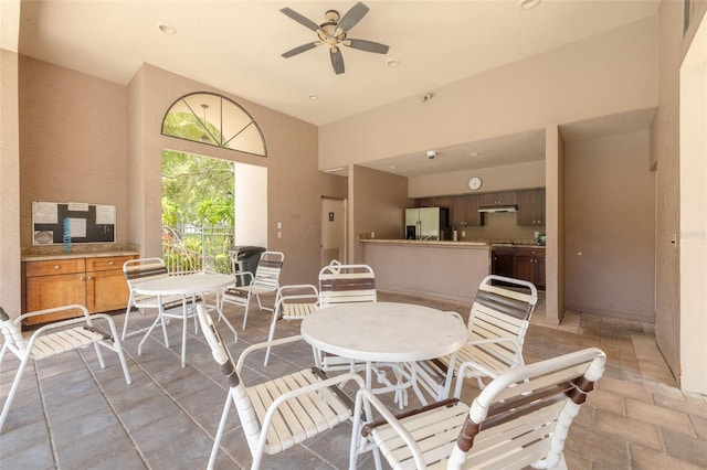 3044 Red Oak Ct Unit 204, Palm Harbor, FL 34684 - dining area featuring a ceiling fan, a towering ceiling, and recessed lighting