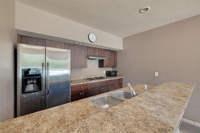 3044 Red Oak Ct Unit 204, Palm Harbor, FL 34684 - kitchen featuring appliances with stainless steel finishes, under cabinet range hood, a textured ceiling, a sink, and a textured wall
