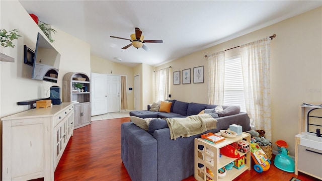 10739 Shady Preserve Dr, Riverview, FL 33579 - living area with ceiling fan, wood finished floors, and vaulted ceiling