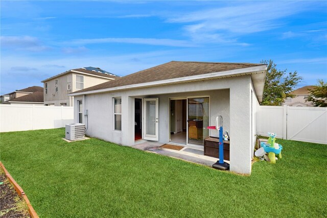 10739 Shady Preserve Dr, Riverview, FL 33579 - rear view of house featuring stucco siding, cooling unit, and roof with shingles