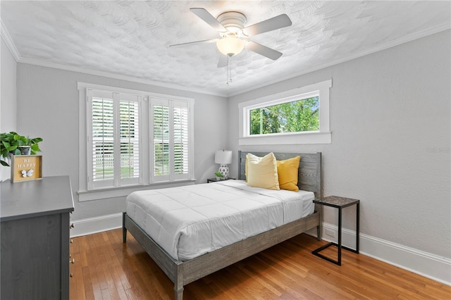3620 W San Pedro St, Tampa, FL 33629 - bedroom with baseboards, hardwood / wood-style floors, a ceiling fan, and ornamental molding
