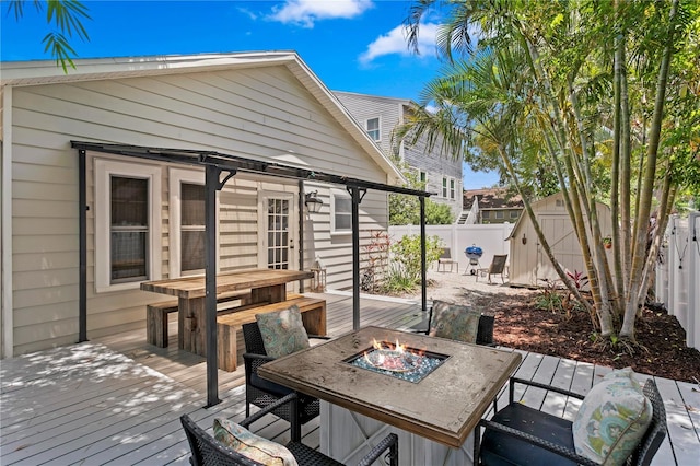 3620 W San Pedro St, Tampa, FL 33629 - wooden terrace with a fenced backyard and an outdoor fire pit