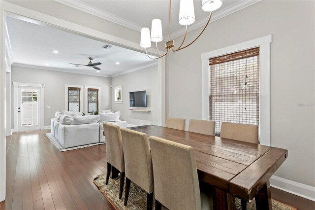 3620 W San Pedro St, Tampa, FL 33629 - dining area featuring ornamental molding, a chandelier, a ceiling fan, dark wood-style floors, and baseboards